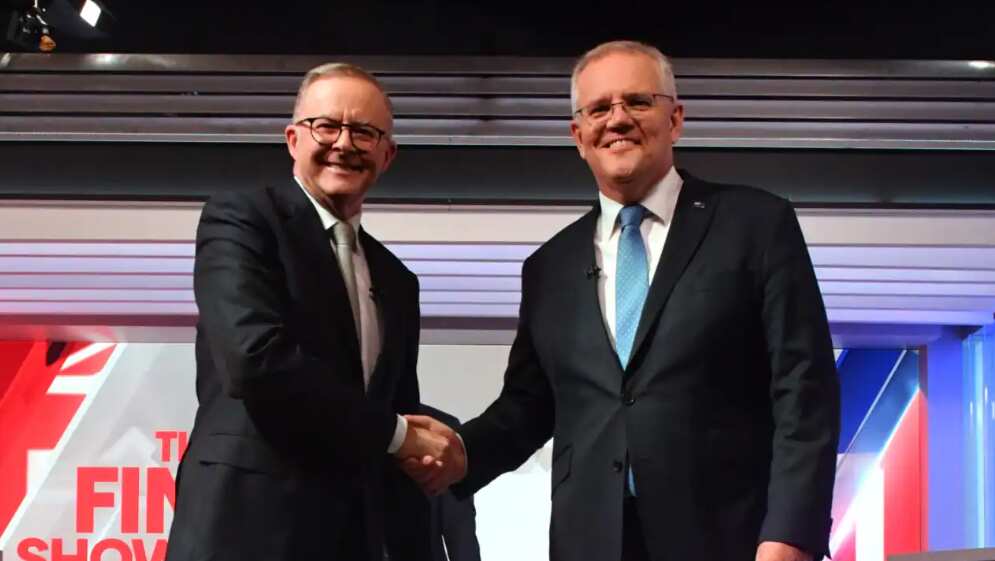 Prime Minister Scott Morrison (right) and Opposition Leader Anthony Albanese shake hands at the start of the final leaders' debate at Seven Network Studios in Sydney. 