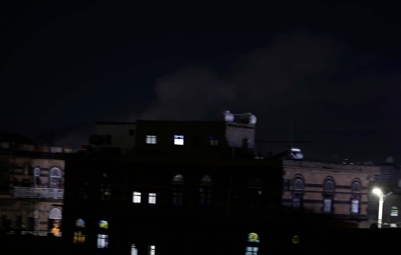 epa09691769 Dust and smoke billow above a neighborhood following Saudi-UAE-led airstrikes targeting a position after the Houthis launched drone attacks on the UAE capital Abu Dhabi, in Sana'a, Yemen, 17 January 2022. The Saudi-UAE-led coalition's warplane