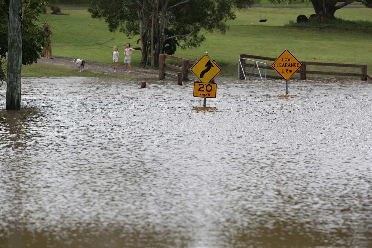 Local flooding in Cooran on the Sunshine Coast, Queensland, Wednesday, February 23, 2022. The body of a 60-year-old has been found in a submerged car in a creek on Queensland's Sunshine Coast after severe rainfall triggered flash floods. (AAP Image/Jono S