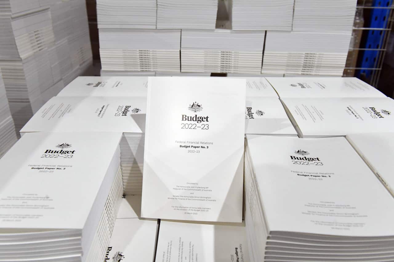 The 2022-2023 Budget Papers are seen at a printing facility prior to being delivered to Parliament House in Canberra, Sunday, March 27, 2022. (AAP Image/Mick Tsikas) NO ARCHIVING