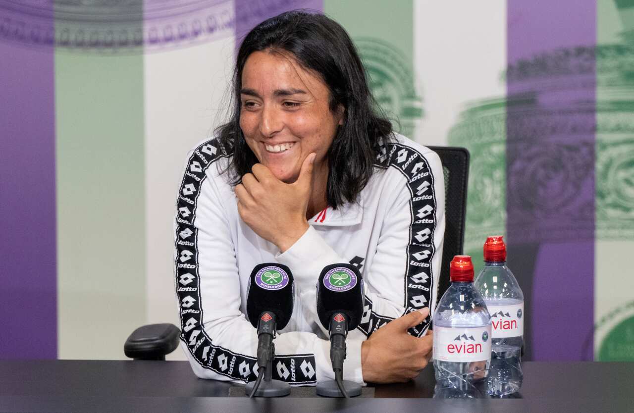 epa10057623 A handout photo made available by AELTC of Ons Jabeur of Tunisia speaking to the press in the Main Interview Room following her win against Tatjana Maria of Germany in the semi finals of the Ladies' Singles at Wimbledon Championships 2022, Wim