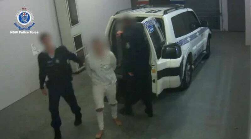 The accused led by police after his arrest.