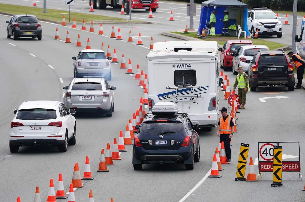 Motorists are stopped at a checkpoint at Coolangatta on the Queensland-New South Wales border.