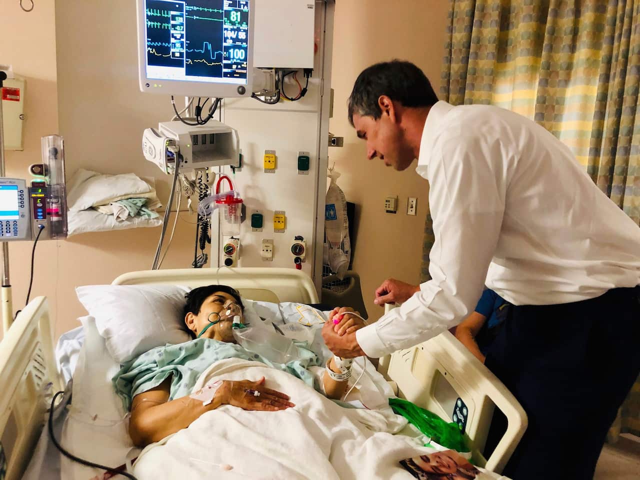Presidential candidate and former congressman Beto O'Rourke meets with mass shooting survivor Rosemary at University Medical Center in El Paso.