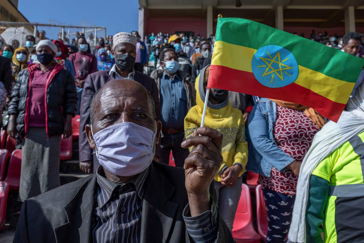 A man holds a national flag in the capital Addis Ababa, Ethiopia