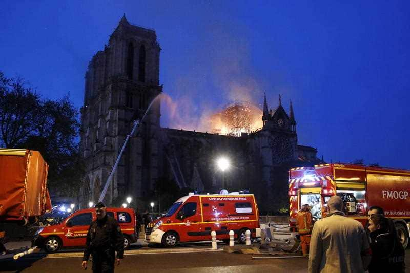 Firefighter battle the blaze as it takes hold inside the historic cathedral.