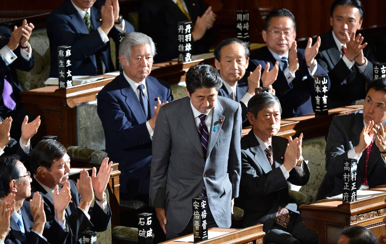 Shinzo Abe bows after he was officially elected Japan's new prime minister in 2012.