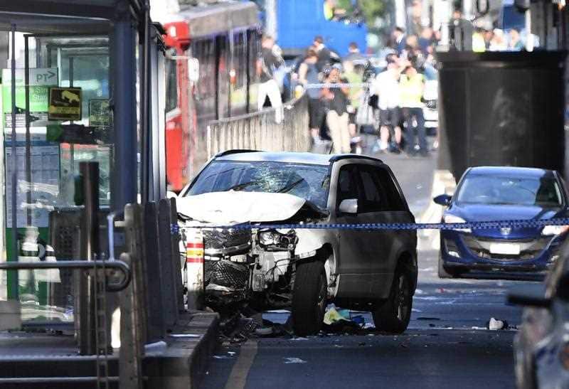 A damaged vehicle is seen at the scene of an incident on Flinders Street, in Melbourne, Thursday, December 21, 2017.