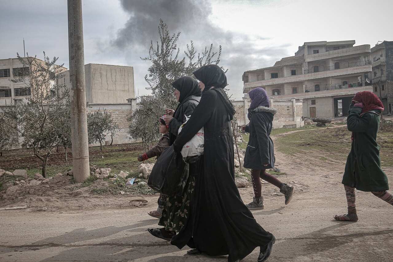 Families flee to safety in Idlib this week.