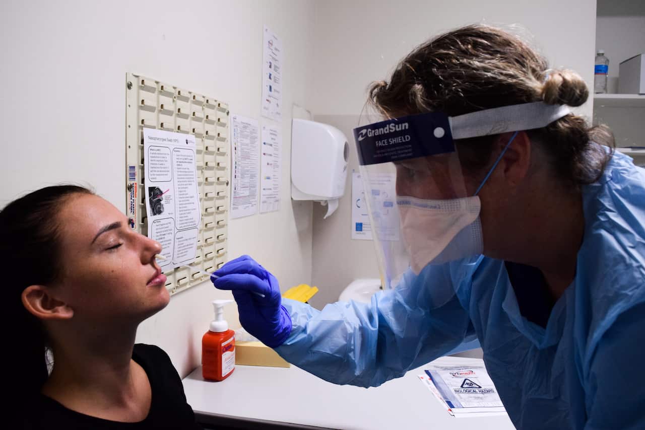 A woman is tested for coronavirus at St Vincent's Hospital in Sydney.