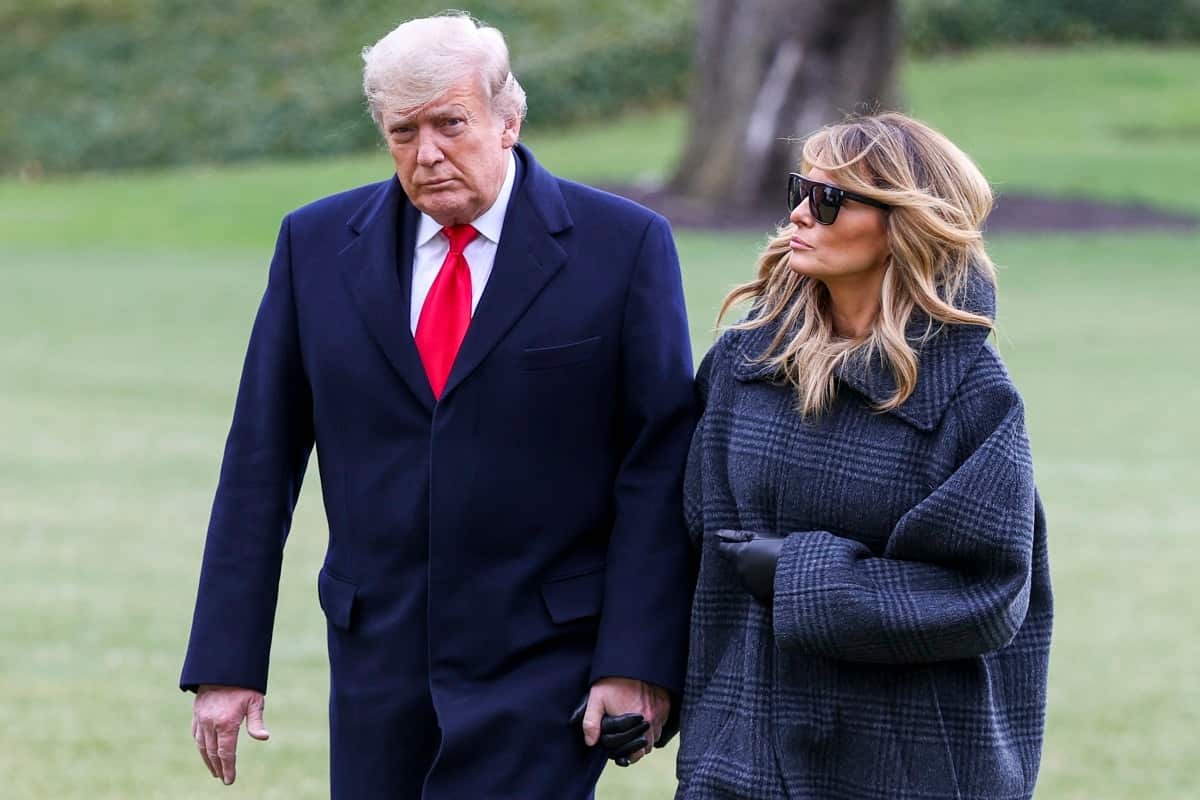 US President Donald Trump and First Lady Melania Trump walk on the South Lawn