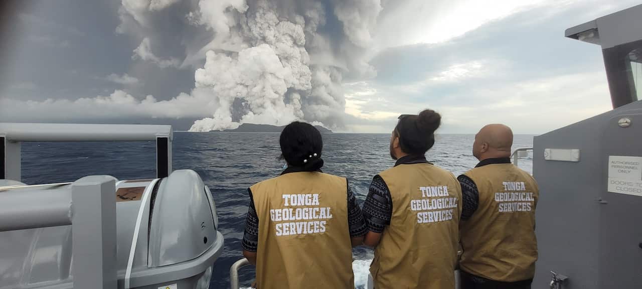 A team of scientists observe the volcano on 14 January, a day before its violent eruption.