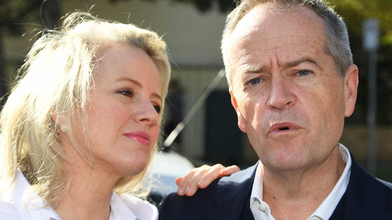 Bill Shorten (right) speaks to media aside wife Chloe outside their property in Moonee Ponds, Melbourne.