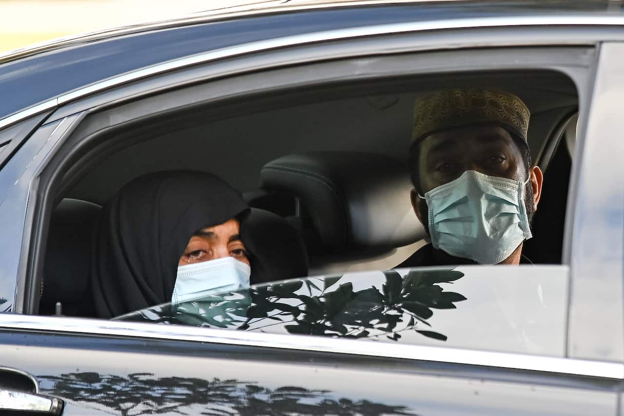 The parents of Ayaz Younus watch from a car as he is buried at the Riverstone Cemetery at Marsden Park, NSW, Wednesday, May 5, 2021. Pakistani national Ayaz Younus,  died in floodwaters in Glenorie NSW in March. (AAP Image/Steven Saphore) NO ARCHIVING
