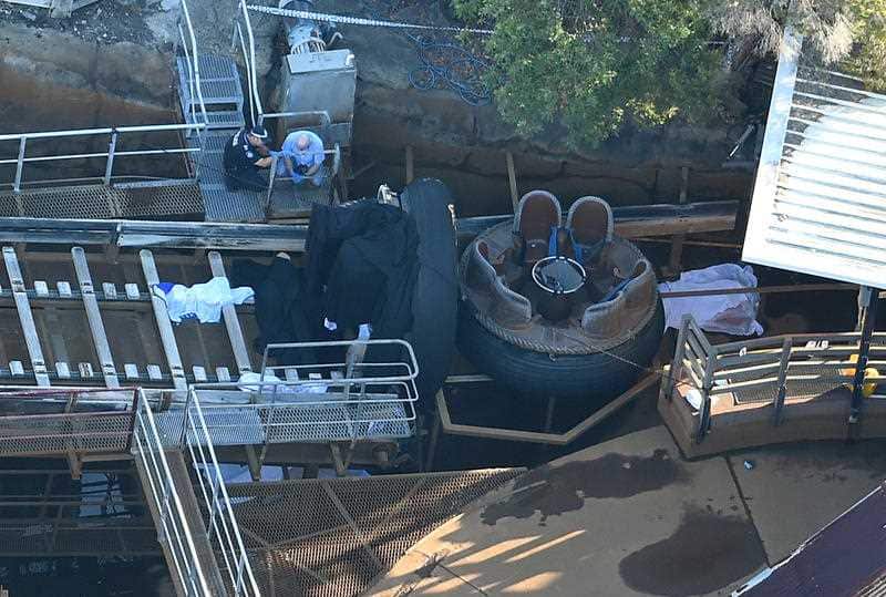 Emergency service personnel are seen at the scene where four people died at Dreamworld on the Gold Coast, Queensland.