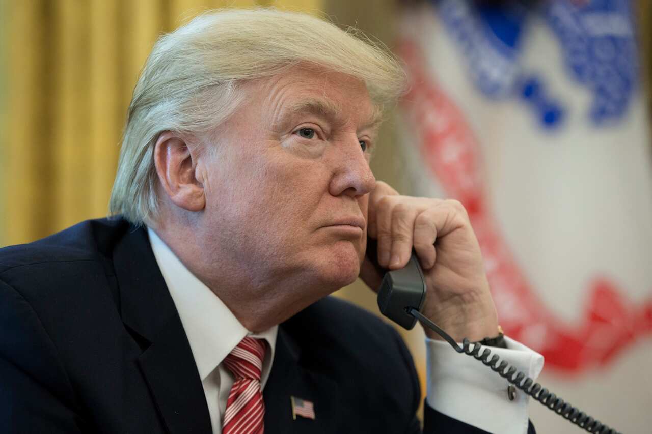 epa06052898 US President Donald J. Trump makes a phone call to Prime Minister of Ireland to Leo Varadkar in the Oval Office of the White House in Washington, DC, USA, 27 June 2017.  EPA/MICHAEL REYNOLDS