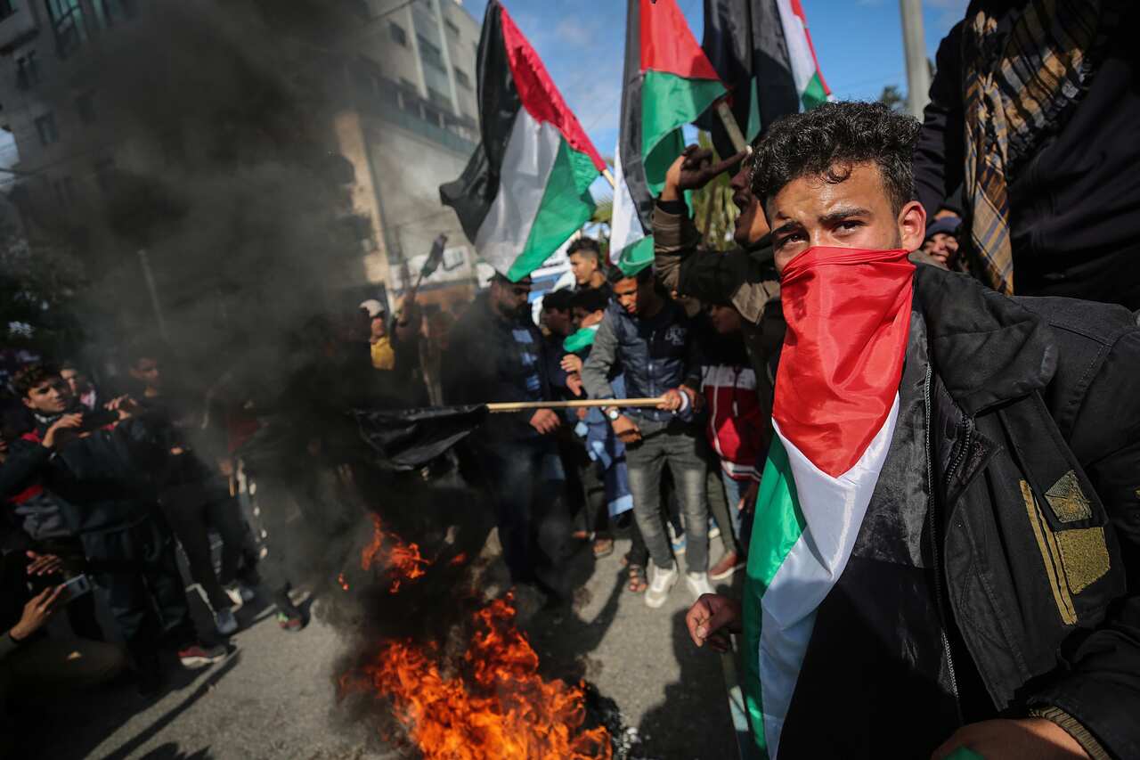 epa08172849 Palestinians chant slogans during a protest against the so-called 'Deal of the Century', planned by Trump to solve the conflict between Palestinians and Israel, in the streets of Gaza City, Gaza Strip, 28 January 2020.  EPA/MOHAMMED SABER