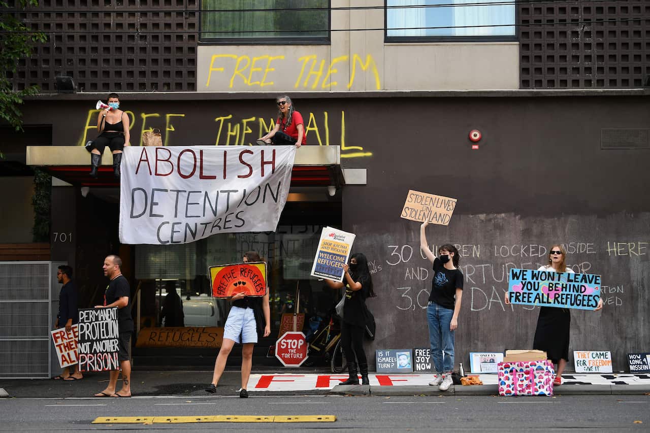 Supporters of asylum seekers protest outside Melbourne's Park Hotel on 6 January, 2022.