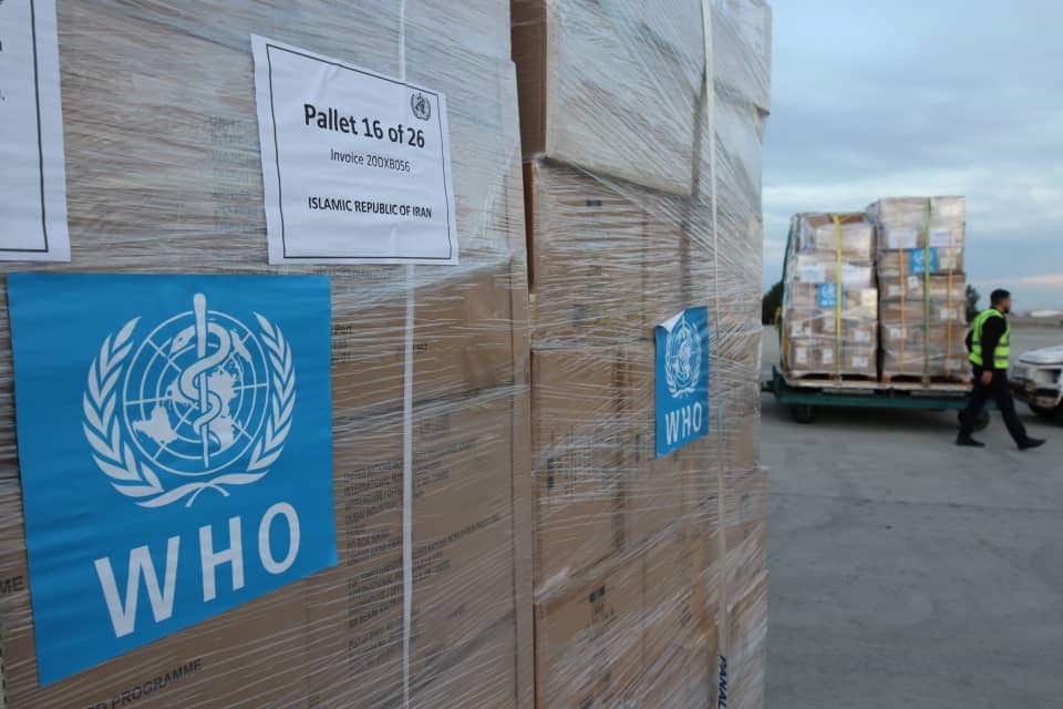 Iranian health ministry photo shows laborers unloading medical equipment and coronavirus testing kits provided by the World Health Organisation.