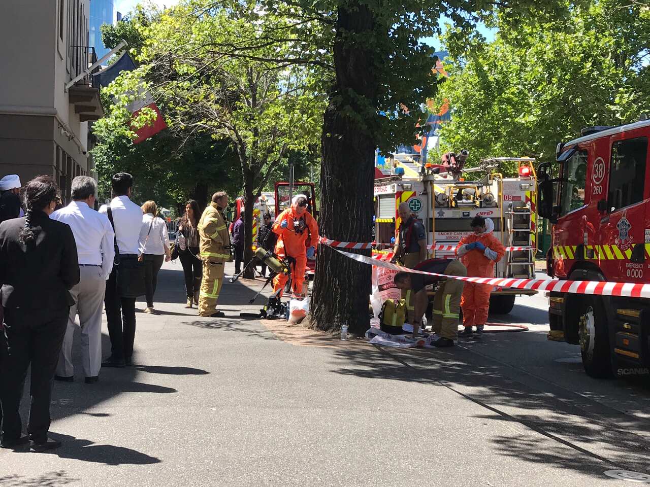 Hazmat and fire crews are seen outside the Indian and French Consulates on St Kilda Road in Melbourne.