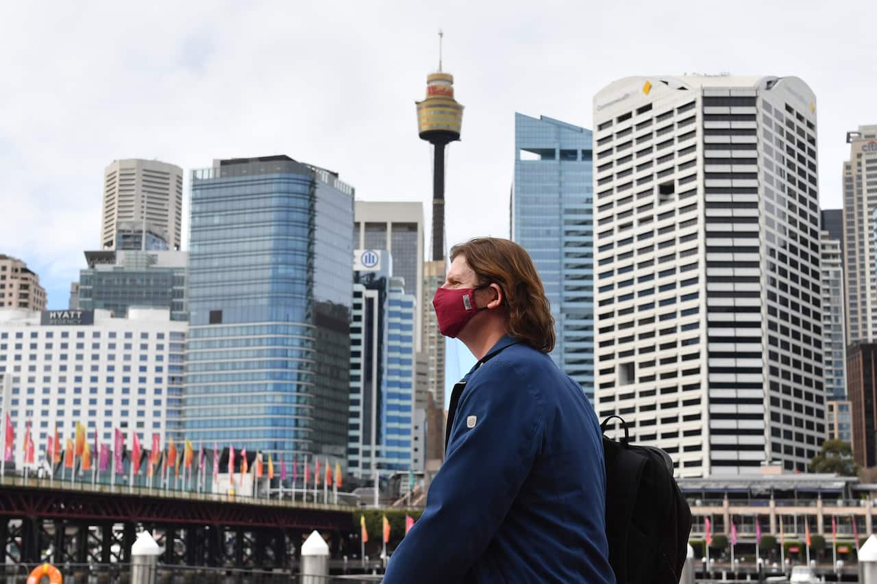 A pedestrian wearing a face mask in Sydney