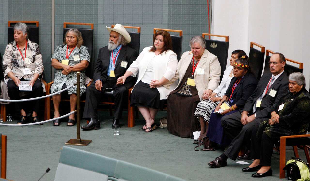 Row of people sitting in the House of Reps