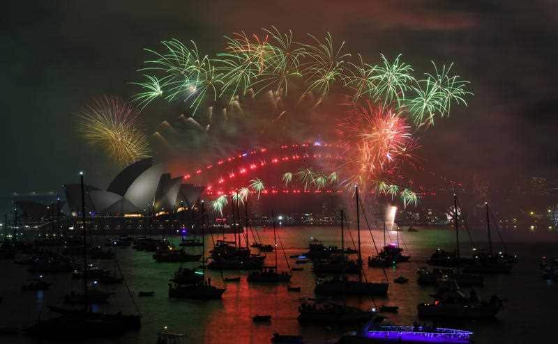 Fireworks explode over the Sydney Harbour during New Year's Eve celebrations in Sydney, Monday, January 1, 2018.