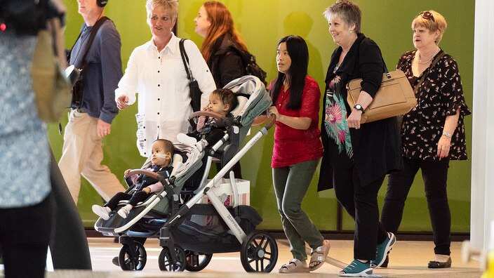 Twins Nima and Dawa with their mother Bhumchu Zangmo upon being discharged from the Royal Childrens Hospital in Melbourne