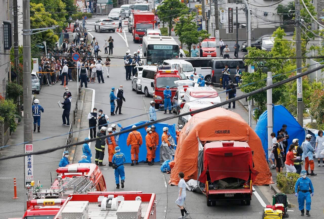 Rescuers work at the scene of an attack in Kawasaki.