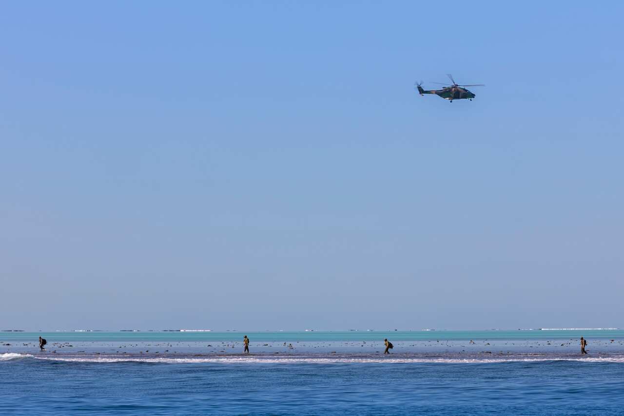 Australian Clearance Diving Team One search the unexploded ordnance in the vicinity of Elizabeth Reef.
