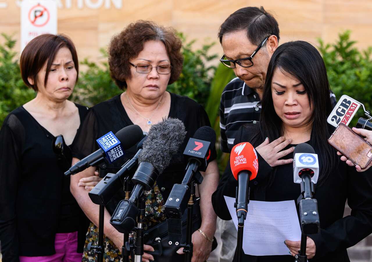 Family members watch on as Quanne Diec's cousin Christine Woo (right) reads a statement outside Granville Police Station, Sydney, Wednesday, 6 November, 2019.