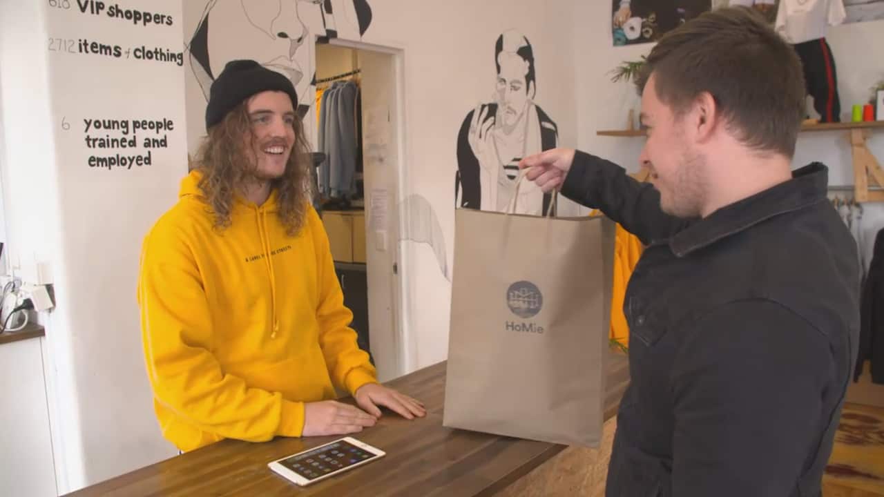 A HoMie employee serves a customer