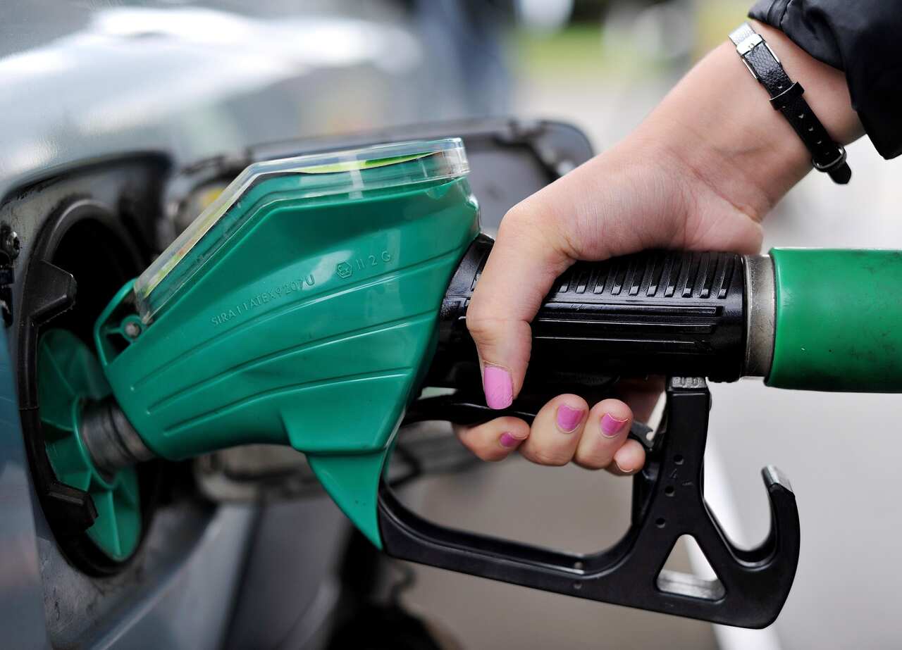 A view of a person using a petrol pump