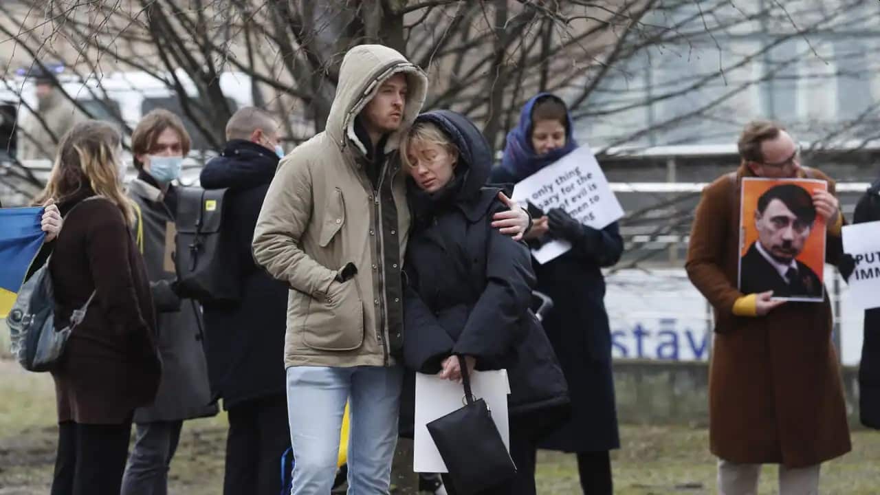 People protest against Russia's military operation in Ukraine outside the Russian Embassy in Riga, Latvia, 24 February 2022.