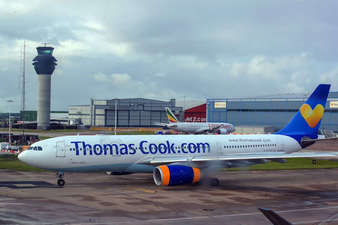 A Thomas Cook plane on the runway at terminal one of Manchester Airport.