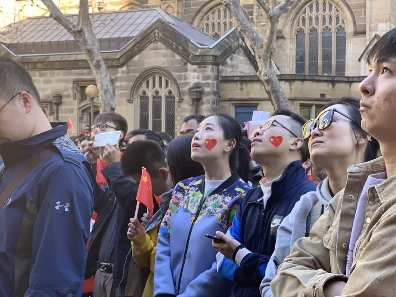 People attend a pro-China march in Sydney