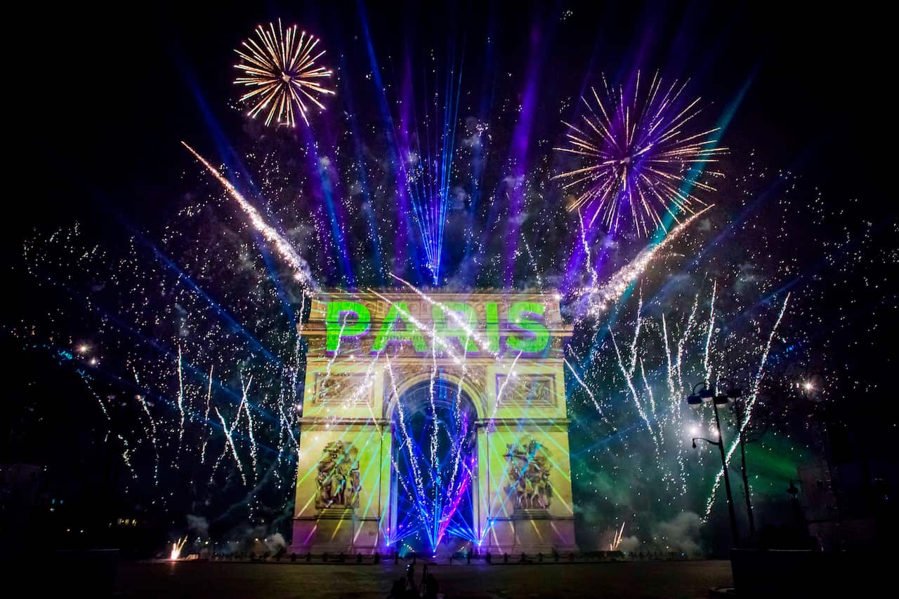 epa08096807 The New Year video display on the Arc de Triomphe on the Champs Elysees in Paris, France, 01 January 2020. EPA/CHRISTOPHE PETIT TESSON