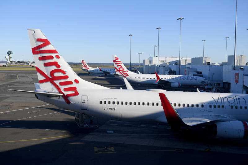 Virgin Australia aircraft are seen at Sydney Domestic Airport, in Sydney on 5 August , 2020.