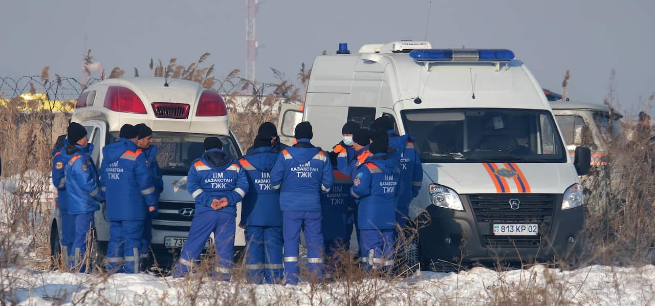 Rescuers work at the site of an airplane crash near Almaty airport, some 20 kilometres from the city of Almaty, Kazakhstan.