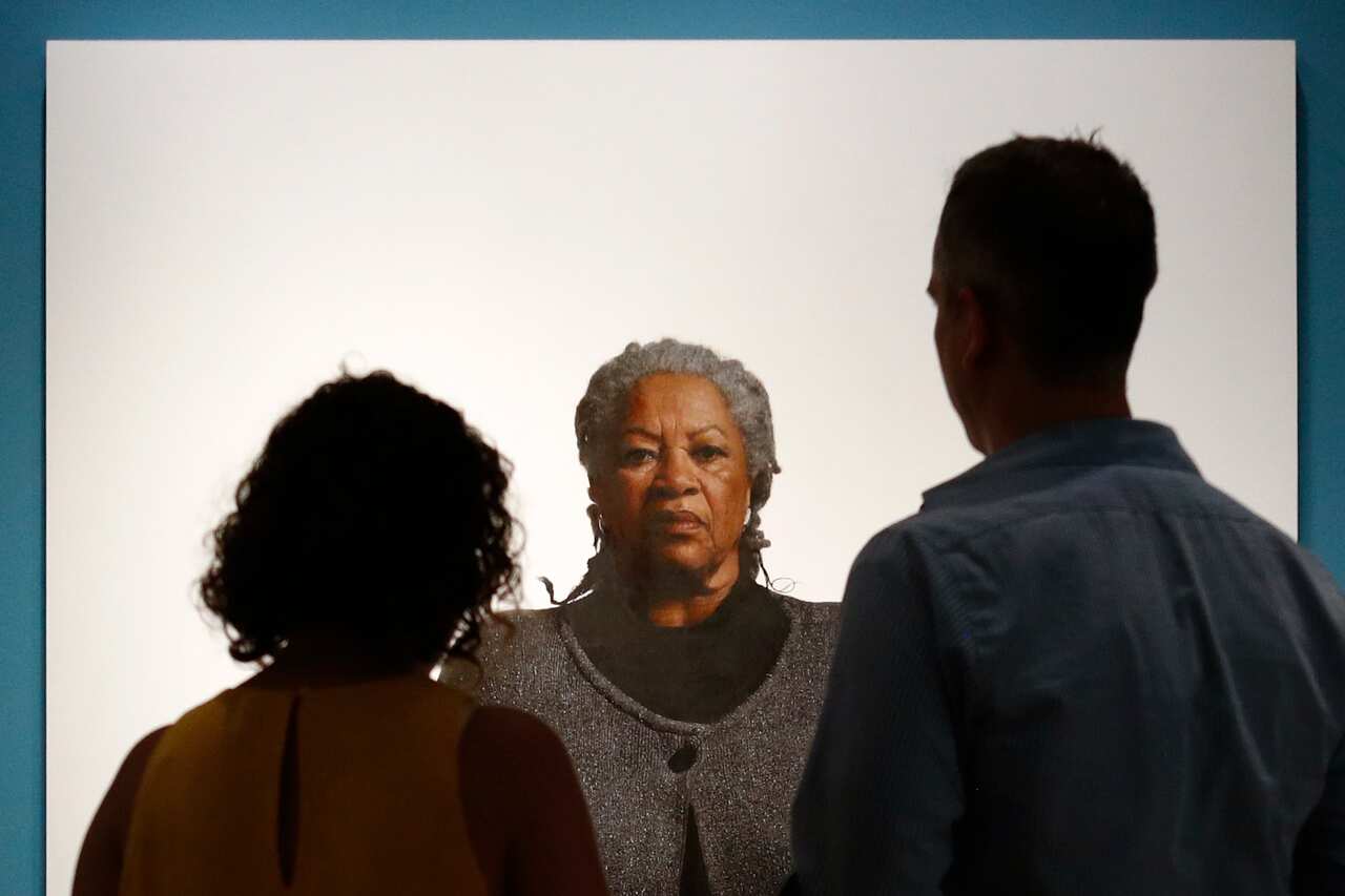 Visitors view a portrait of Nobel laureate Toni Morrison, painted by the artist Robert McCurdy, at the National Portrait Gallery in Washington.