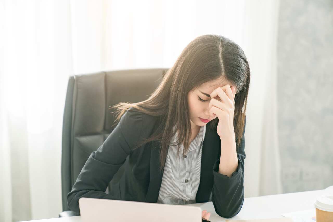 female worker looking tired