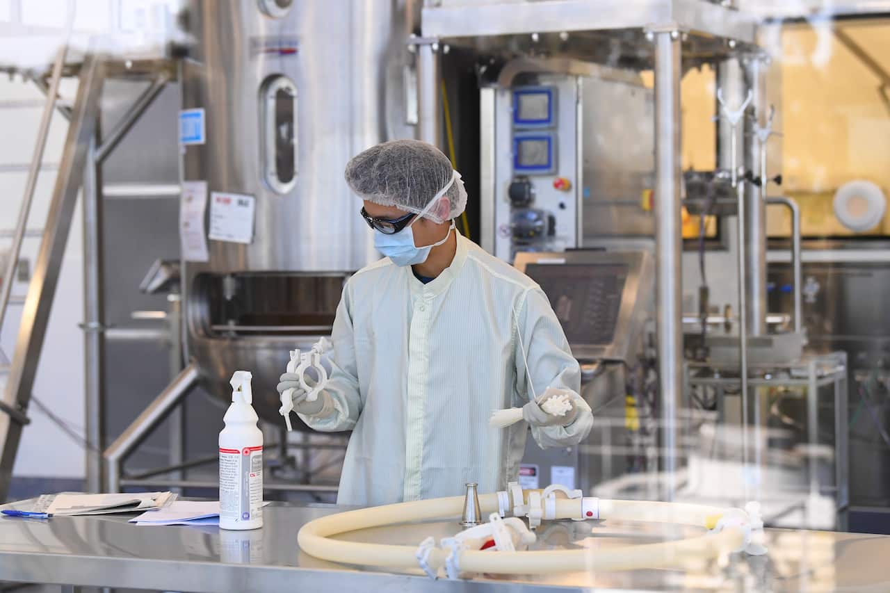 Scientists work on a COVID-19 vaccine at the CSL Biotech facility in Melbourne.