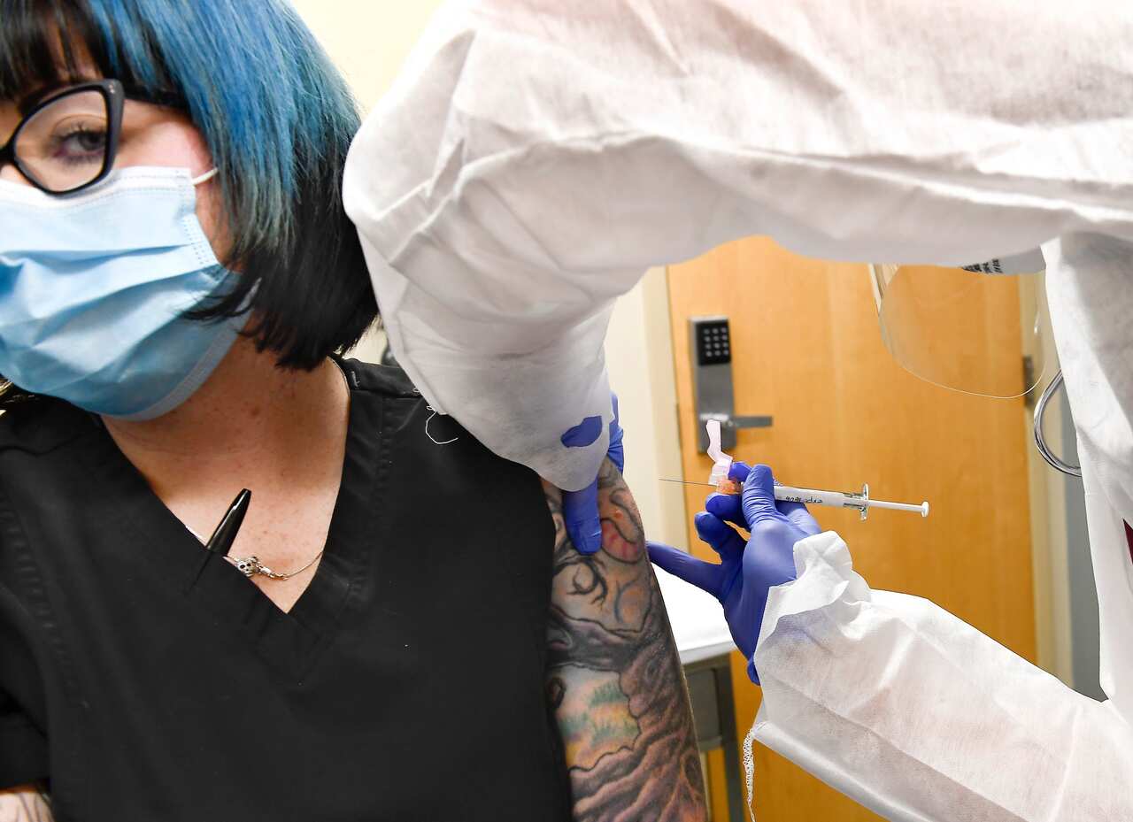 Melissa Harting of Harpersville, New York participates in a study of the vaccine for COVID-19 developed by the National Institutes of Health and Moderna.