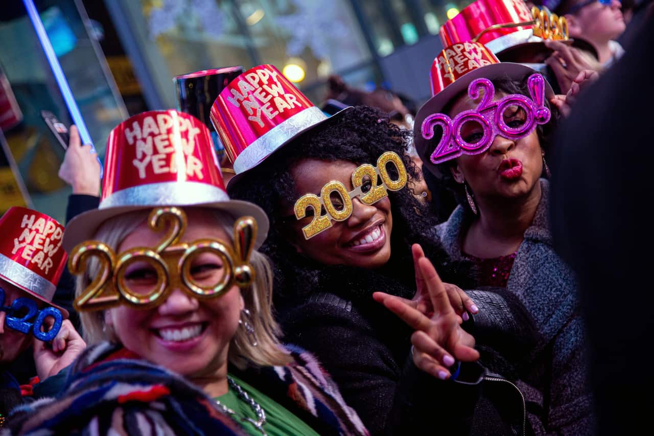 People gather during New Year's Eve celebrations at Time Square, New York, USA, 31 December 2019. EPA/ANGEL COLMENARES