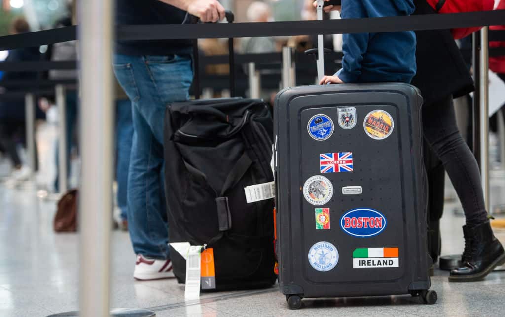 Travellers wait at Dusseldorf Airport, Germany.