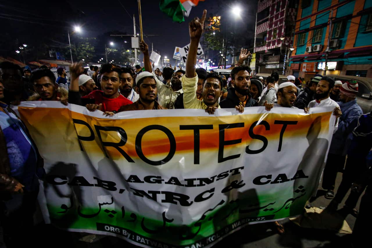 Indians shout slogans as they gather and take out a rally for a protest against the Citizenship Amendment Act.