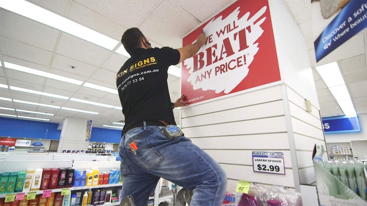 Oxin Signs installs sign in pharmacy.