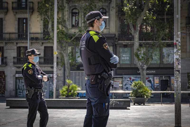 Police officers in Barcelona, Spain wearing face masks amid the coronavirus lockdown