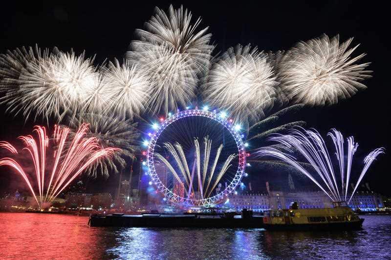 Fireworks light up the sky over the London Eye in central London during the New Year celebrations.