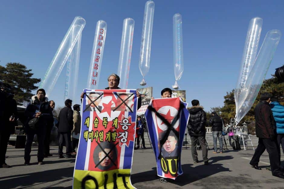 Park Sang Hak, center right, sends tens of thousands of plastic fliers across the North Korea border every year.